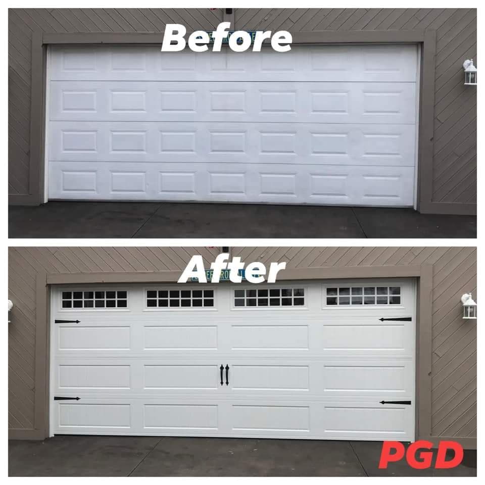 Before and after: a white raised-panel double garage door, replaced with a white carriage-style door with divided windows, black handles and strap hinges.
